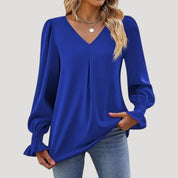 Blusa con cuello en V y mangas largas abullonadas: estilo elegante para la oficina. 13