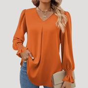 Blusa con cuello en V y mangas largas abullonadas: estilo elegante para la oficina. 15