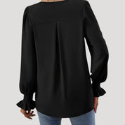 Blusa con cuello en V y mangas largas abullonadas: estilo elegante para la oficina. 4