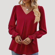 Blusa con cuello en V y mangas largas abullonadas: estilo elegante para la oficina. 7