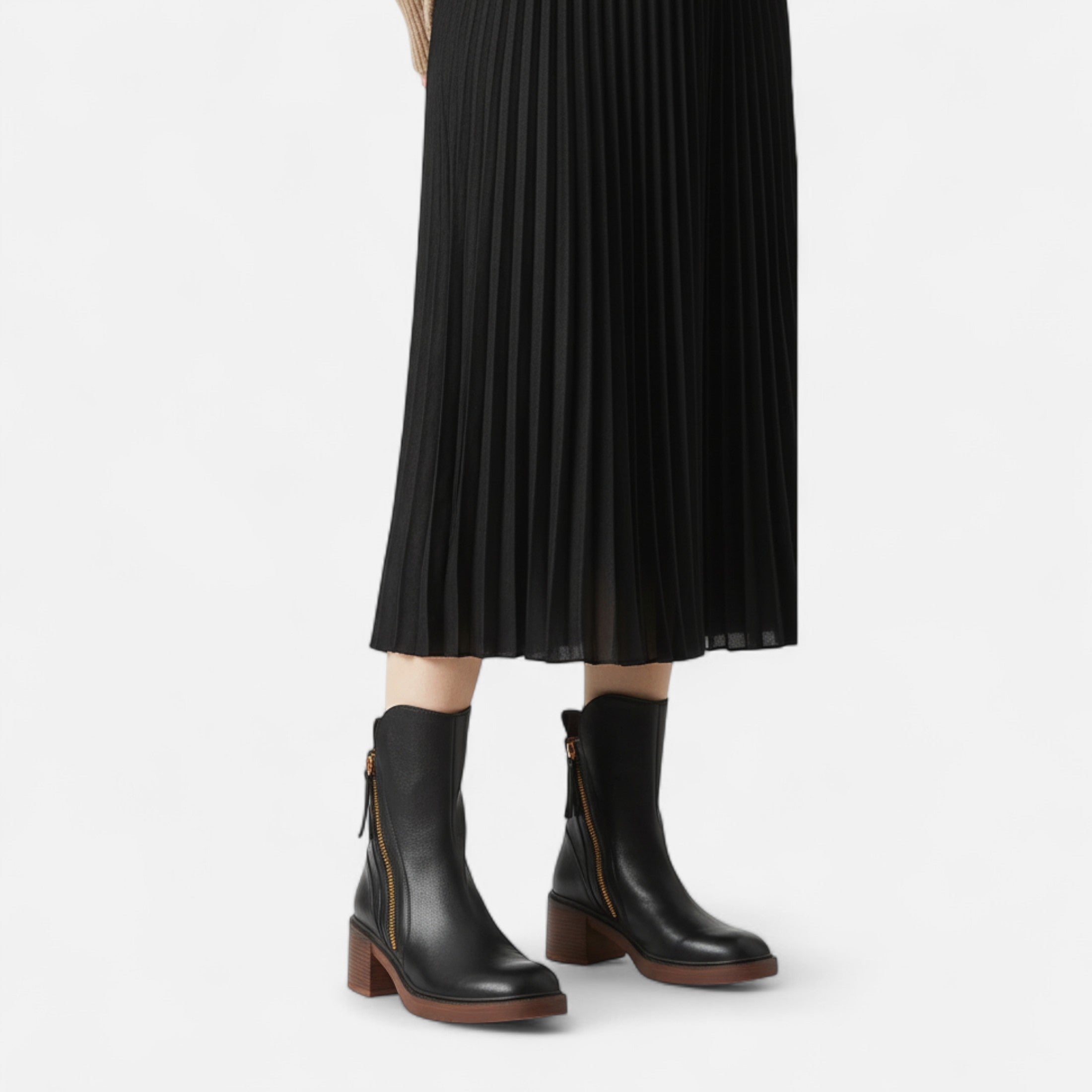 Botines negros con cremallera: calzado elegante de invierno 1