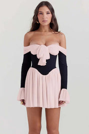 Minivestido con detalle de lazo en los hombros – Look romántico para cóctel 0