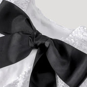 Minivestido de lentejuelas con detalle de lazo de satén: ¡una declaración de estilo para fiestas glamurosas! 3