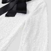 Minivestido de lentejuelas con detalle de lazo de satén: ¡una declaración de estilo para fiestas glamurosas! 4