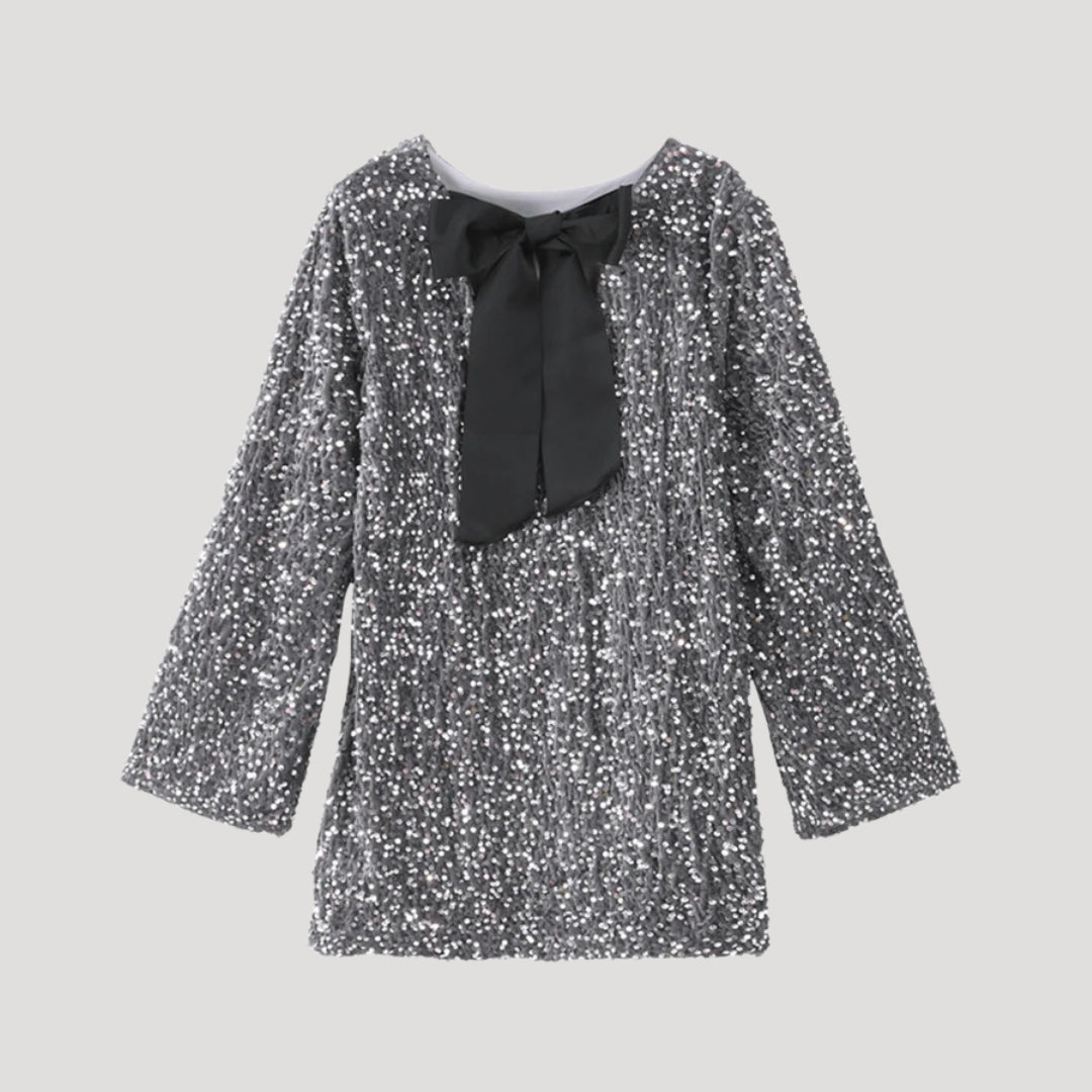 Minivestido de lentejuelas con detalle de lazo de satén: ¡una declaración de estilo para fiestas glamurosas! 9