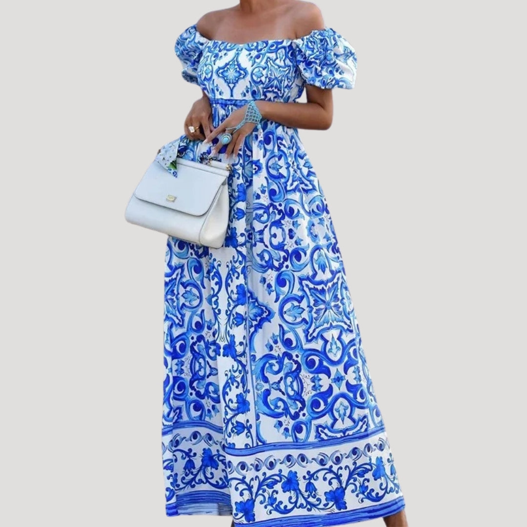 Vestido largo con hombros descubiertos y mangas abullonadas: un estilo veraniego sin esfuerzo 0